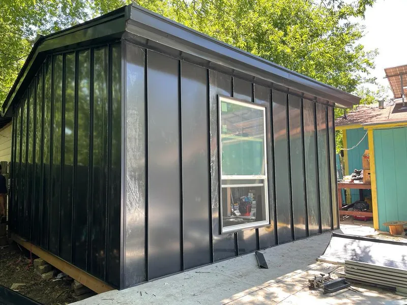 Black standing seam metal wall panels for Roof Inspection in Crosspointe