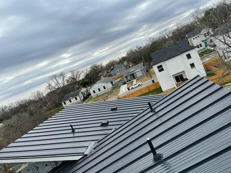 Standing seam metal roof panels with vents for Skylight Repair in Crosspointe